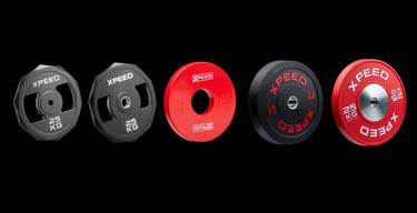 a selection of weights like plates, kettlebells, dumbbells and more
