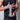 Xpeed athlete wearing black athletic wear with white patterned hand wraps on a neutral background