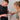 Man applying Xpeed wrist wrap to a woman's wrist against a white tiled wall.