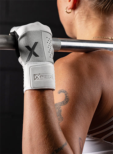 female athlete using Xpeed hybrid training gloves