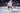 An MMA fighter celebrates a knockout win in Xpeed MMA glvoes