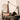 Person using a Pilates reformer machine in a home setting.