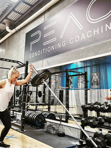 Australian Olympian Erin Phillip straining with Xpeed crossfit equipment at PEAQ Performance