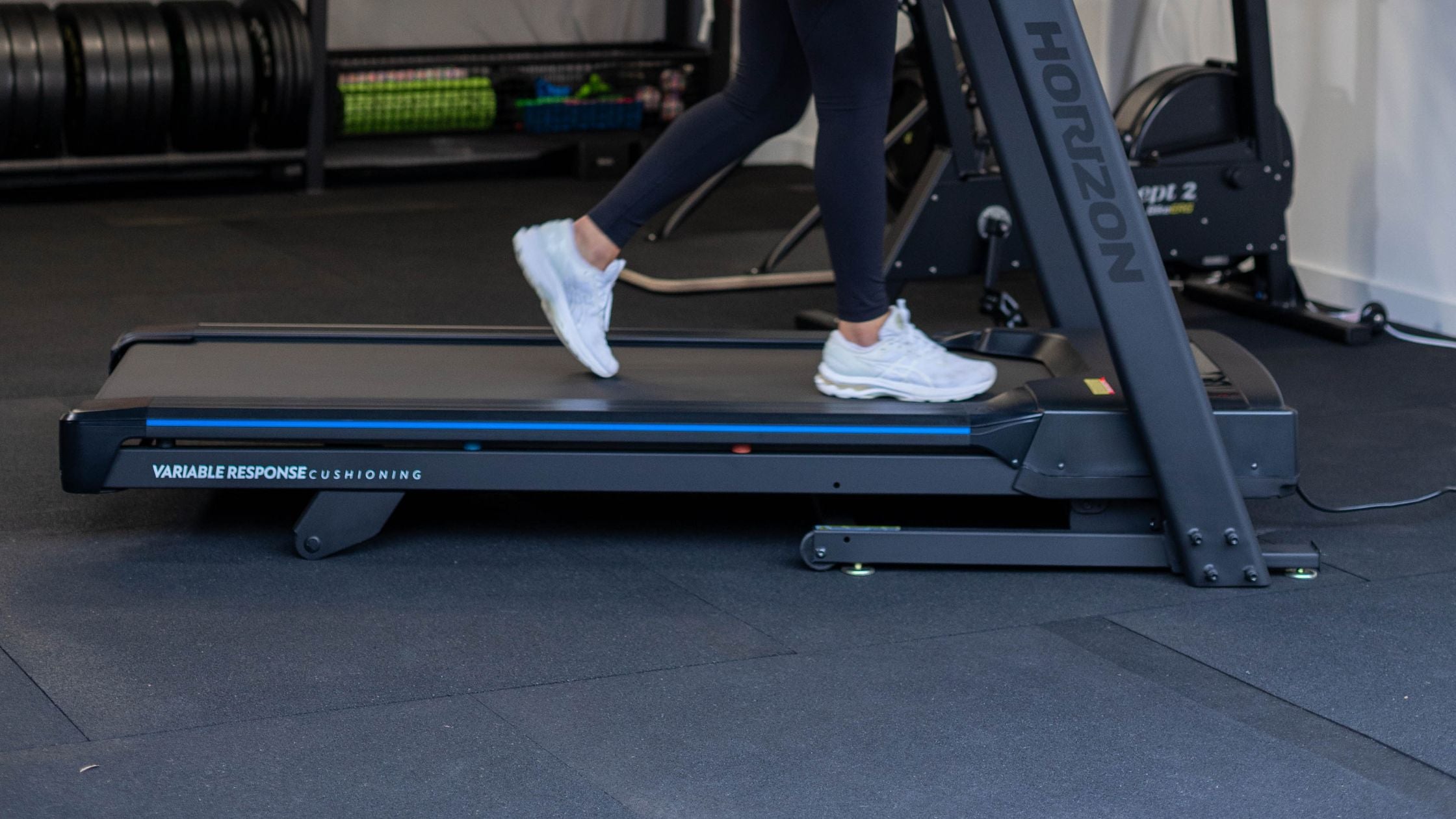 woman walking on a horizon treadmill